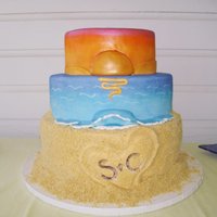 Aruba Sunset Wedding cake for a couple who got married in Aruba and had their reception at home. The bottom tier was covered with Nilla Wafers that I...
