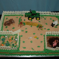 Farm Cake the tractor is a toy, but all the animals, and vegs are mmf, the fence is white chocolate