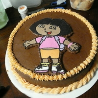 Dora Chocolate Buttercream with a Buttercream Transfer Dora.