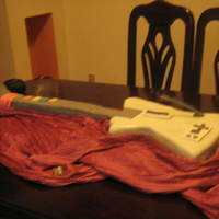 A Guitar Hero For My 15 Years this guitar was made yourself with a chocolate cake and vanilla GenoiseSatin fondant