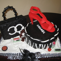 Diva Cake The Chanel purse is made out of RKT and the round one is the cake. The shoes is made out of fondant with lots tylose powder in it. The make...