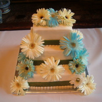 Square With Real Flowers This was 12, 8, 6. Top and bottom were white cake filled with Richs bettercream, the middle layer was chocolate cake with peanut butter...