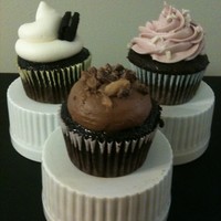 Cupcake Trio White Chocolate Raspberry Truffle, Toffee Crunch, and Black and White cupcakes.