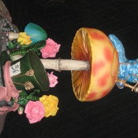 Tim Burton's Alice In Wonderland Cake Inspired by Tim Burton's recent movie version, this cake features Absolem the caterpillar with his hookah sitting atop a tilted...