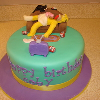 Simpson's Birthday cake made for my brother who is a huge Simpson's fan. WASC cake with MMF covering. Gumpaste, Modeling Chocolate, RKT and...