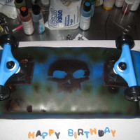 Skateboard Cake 11 x 15 sheet and 8x 8. shaped. Chocoalate cake. vanilla BC covered in MMF. Airbrushed. Yes I cheated. Those are real wheels. After two...