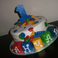 Ahmad Turns 1 Entire cake is edible. Blocks made of MMF.