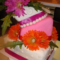 Topsy Turvey Gerber Daisies This is my first topsy turvey cake, first wedding cake and second tiered cake.