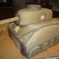 Tank This is a tank cake for an 8 year old boys birthday. Chocolate and vanilla cake, MMF with BC piping. The sand is brown sugar