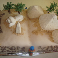 Egypt this is a "book of egypt" cake made for my mothers birthday. The pyramids, sphynx and obolisk are gumpaste, my first go at it....