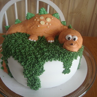 Dinosaur Cake This was made for a baby shower for my nephew. It was also my first experience with fondant. I found it to be super fun. The dinosaur, as...