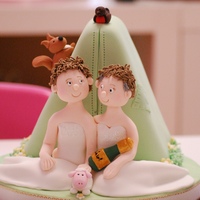 Elaine And Janes Wedding A little tent in the background, a squirrel and a robin perched on top. The Brides sitting in front with a baby lamb and a nice big bottle...