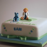 Sam And His Teddy A little boys' 1st Birthday Cake with his favourite blue teddy.