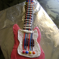 First Guitar Chocolate & vanilla frosting on a buttercake with candy decorations