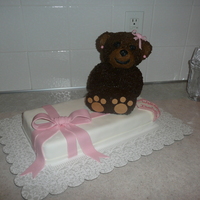 Beary Cute Baby Shower Cake Vanilla present cake covered in ivory MMF and a rose pink bow. Chocolate bear with chocolate buttercream icing and fondant bow, earrings...