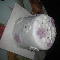 Mini Flowers. Chocolate Cake with Chocolate Ganache and buttercream. Covered in fondant, with fondant flowers.