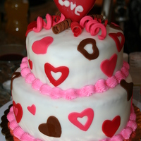 Happy Valentine's Day 2010 bottom is 8 x 3 inch vanilla cake with chocolate filling with health toffee bits covered with white fondant red, pink, brown hearts, pink...
