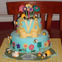 1St Birthday Bee And Flower Cake This was my first fondant cake, made for my daughter's 1st bday party! All decorations and figures made from MMF. 9" and 6"...