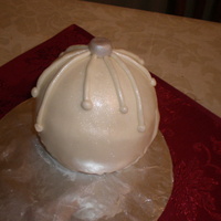 Christmas Ornament I saw a bunch of these on cc and I had to try! It's pound cake with bc covered in fondant and dusted with luster dust.