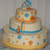Winnie The Pooh Themed Baby Shower Cake buttercream with fondant accents. gumpaste bootie topper. (I still haven't mastered the whole smooth buttercream thing :) but i'm...