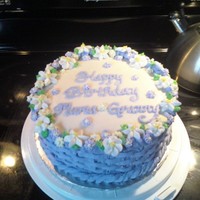 Basket Of Flowers Basket weave with buttercream icing, flowers made from royal icing. The 80 year old Mama / Granny was tickled pink!