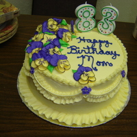 Birthday Cake With Pansies This cake was covered in buttercream with royal pansies. The pansies were hand-painted with accents using coloring gel thinned with water....