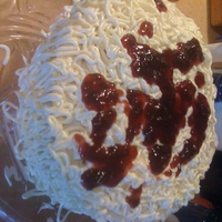 April Fools!!! 8' white cake covered in cream cheese frosting. topped with cherry preserves for the "spaghetti sauce"