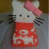 Ally's Hello Kitty bottom layer white cake, top layer chocolate cake, buttercream icing covered in fondant. hello kitty head was made of pink valentine rice...