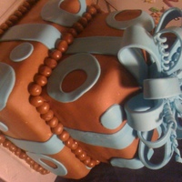 Kayla's Birthday Cake WASC cake with buttercream icing. Covered in fondant with fondant accents and fondant/gumpaste bow.