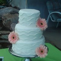 Squiggles This was my first wedding cake. I'm ok with how it turned out. I took too much buttercream off while smoothing it so I need to work on...