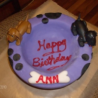 Dog Bowl With Daschunds Just a small cake I put together for my best friends mom. I know the writing is not too appealing....I didn't have alot of time to...