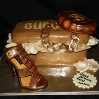 Shoe This was my first shoe....it is made of gumpaste and fondant....I sprayed it with copper and gold luster dust to get the leather look. TFL...