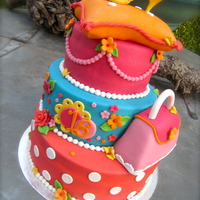 Over The Top! This over the top birthday cake was for a girl who turned sixteen today. She likes bright colors and she wanted a litlle purse on her cake...