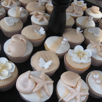 Romantic White&ivory Romantic themed Cupcakes in White and Ivory, for 25-year wedding anniversary. Vanilla cupcakes filled with praline-cream. Delicious;)