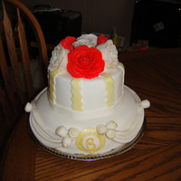 Anniversary This is a cake I made for my parents anniversary. Top tier is a faux cake, bottom tier is white chocolate, cheesecake mousse filling and...