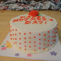 Mother's Day 9" white chocolate cake with cheesecake mousse and white chocolate buttercream.