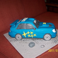 Subaru Blue Subaru. Pound cake, carved. Covered in fondant.