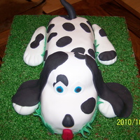 Dalmation Vanilla cake carved and stacked. Covered in fondant.