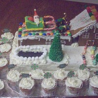 Christmas Cake Made this cake for Christmas. Vanilla cake with white buttercream. Santa, sleigh and reindeer our made out of fondant. The house is made...