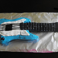 Guitar Cake The first non-conventional shaped cake I attempted. My husband loved it!