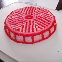 Pink And Red This is the first cake I made at my level 1 Wilton class at Michaels. The book recomended making a rainbow, but it was valentine's day...