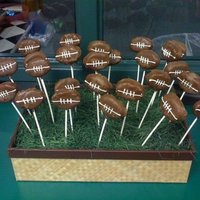Football Cake Balls These are cake balls shaped into footballs dipped in milk chocolate. These went along with a football field cake I did.
