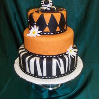 Zebra And Orange Fondant Cake This is my final cake for Wilton Course 4. Each tier is covered with fondant wiith a fondant zebra at the top. I was very happy with the...