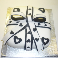 Course 3 Present Cake Red Velvet cake with cream cheese filling, iced with buttercream and covered in black and white fondant.