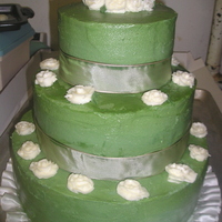 3 Tier Wedding Style Birthday Cake This was our first 3 tier cake. Customer wanted it in sage green with white roses. Thank goodness we did the roses for the top tier before...