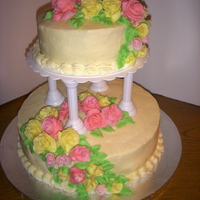 Two Tiered Wedding Cake In Buttercream I did the cake again but this time used butter cream frosting and made fondant roses.added buttercream leaves around the cascading flowers...