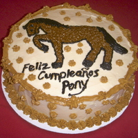 Pony Cake round 9" layer cakes, covered in cream cheese frosting. We used a transfer method to put the pony on the cake -