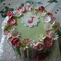 Happy Birthday Sis Banana cake with cream cheese filling. Covered in fondant with gumpaste flowers.