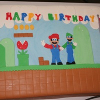 Itsa Mario! Chocolate vegan cake(box mix) I made for a friend. 13x9" with fondant. Each piece was cut by hand with a paring knife.