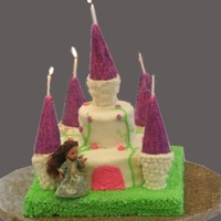 Fairytale Castle 11x11" hershey's chocolate cake base, with 8" vanilla cake and 4" chocolate cake castle. All decorated with buttercream...